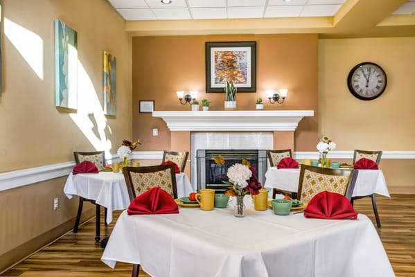 Elegant dining room setup with tables and food