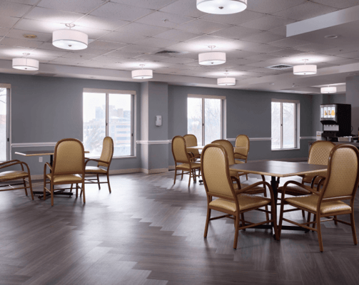 Bright common area with tables and chairs