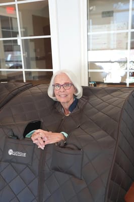 Resident enjoying a wellness session in a cozy room