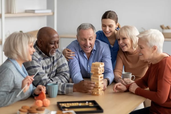 Residents enjoying a game of Jenga in a common area