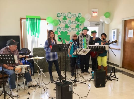 Residents enjoying a live music performance for St. Patrick's Day.