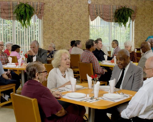 Residents enjoying a meal in the dining room