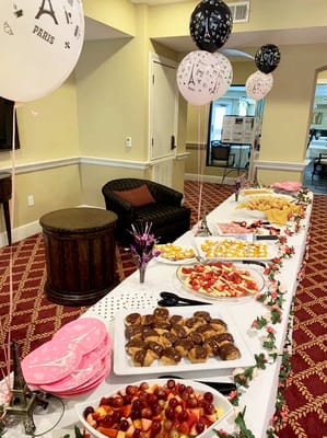 A festive table with assorted desserts and decorations