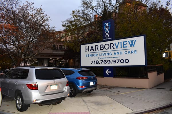 Exterior view of Harbor View Home with vehicles parked