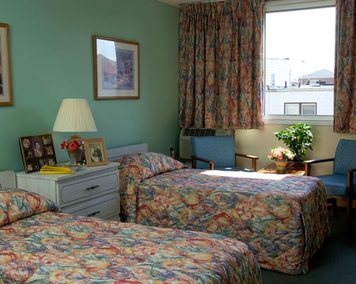 Private resident room with two beds and decor