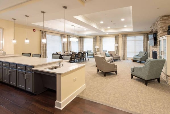Bright common area with seating and dining space