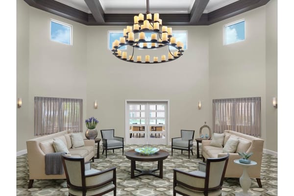 Interior lobby area with seating and chandelier