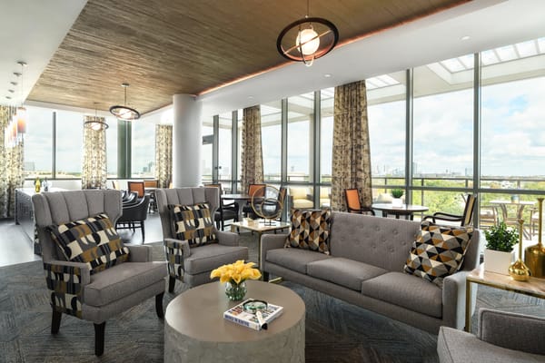 Bright and spacious common area with seating and large windows