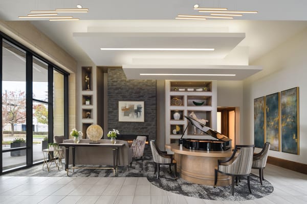 Elegant interior lobby with a grand piano and seating area