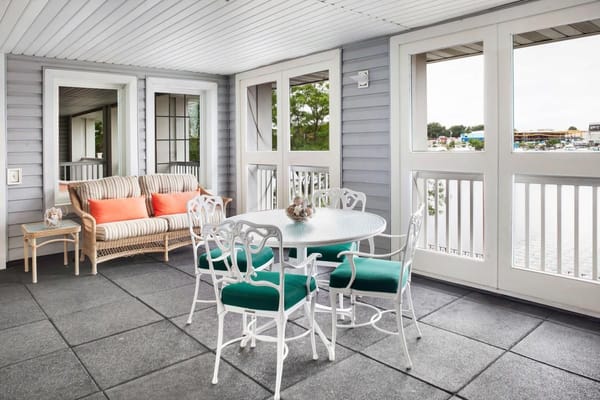 Cozy outdoor patio with seating and a table