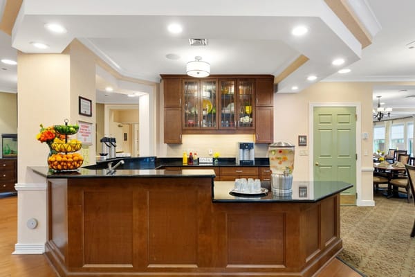Bright common area with a kitchen and dining setup