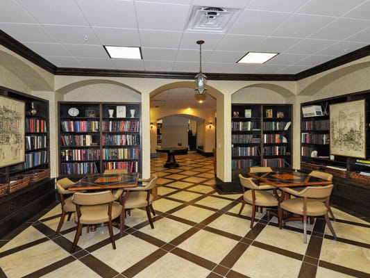 Bright common area with bookshelves and seating