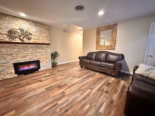 Cozy common area with a fireplace and seating