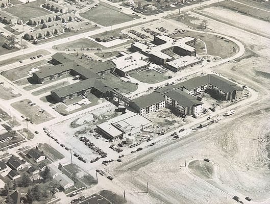 Aerial view of a senior living facility and grounds