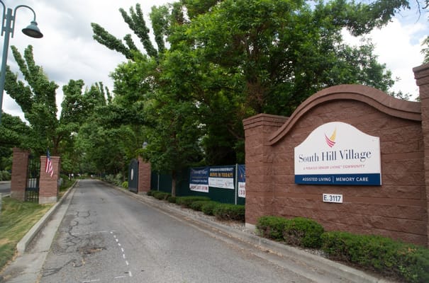 Entrance sign for South Hill Village, a senior living community