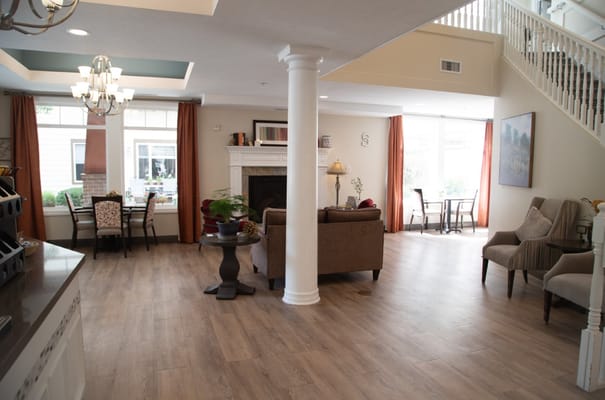 Interior view of a cozy lobby with seating and a fireplace
