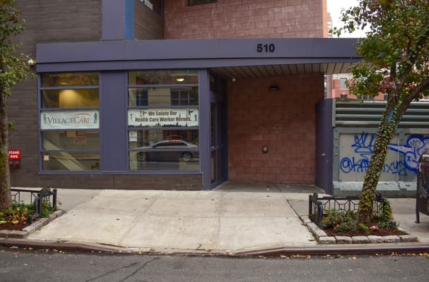 Facade of VillageCare at 46 & Ten, featuring a welcome sign