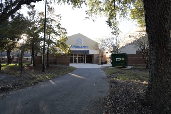 Entrance to a facility with an ambulance sign