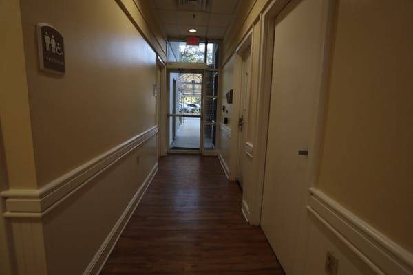 Interior hallway leading to restrooms and exit
