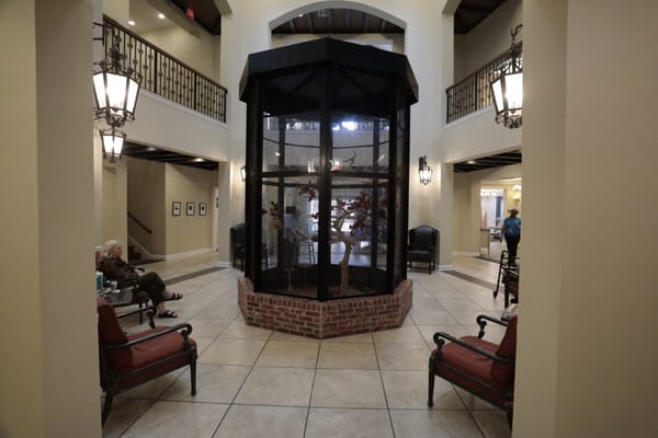 Interior view of a common area with residents relaxing