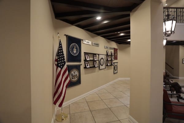 Interior hallway with flags and display panels