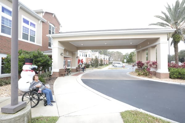 Entrance to Anthem Lakes with residents enjoying the outdoors