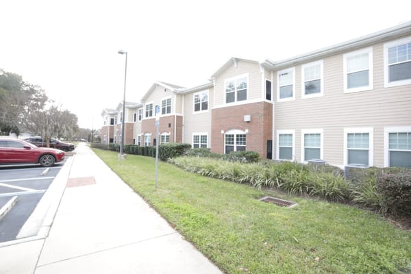 Exterior view of Anthem Lakes facility with landscaping and parking