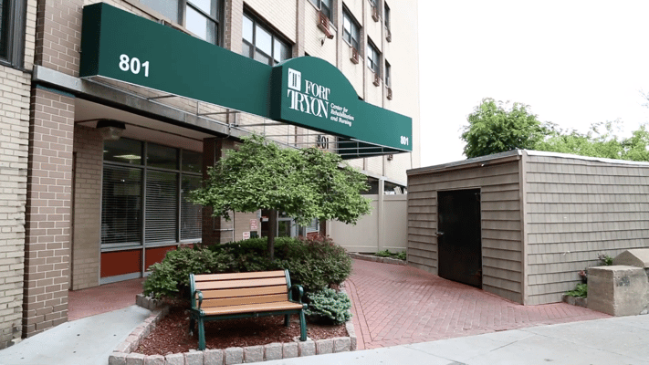 Exterior view of Fort Tryon Center entrance with landscaping