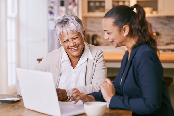 Two women enjoying a computer session together