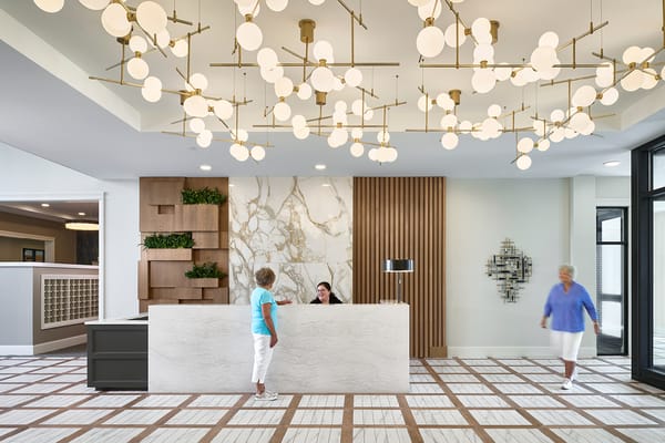 Welcoming reception area with staff and residents