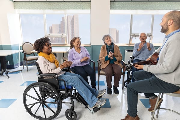 Residents enjoying a music activity in an indoor space