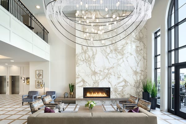 Modern lobby with elegant chandelier and seating area