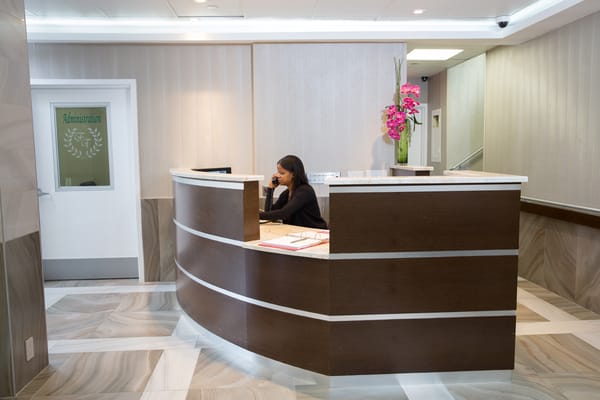 Reception area with a staff member at the desk