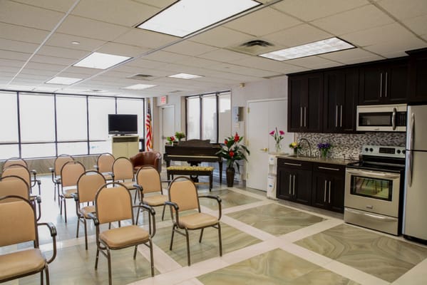 Bright common area with seating and kitchen space