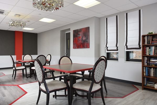 Bright common area with tables and chairs