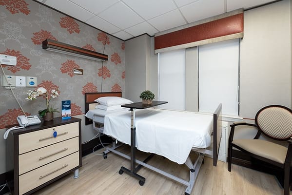 Patient room with a bed and calming decor