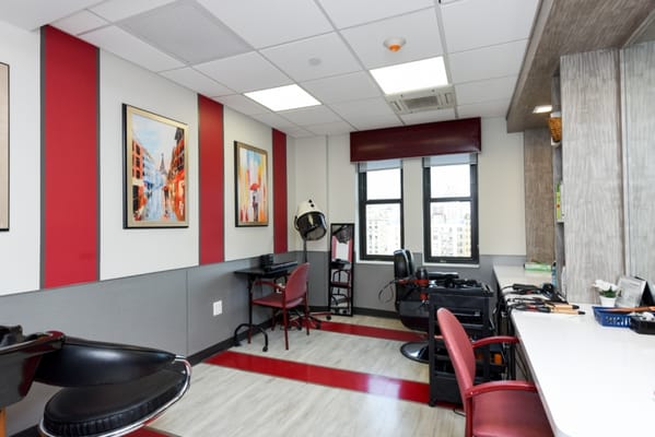 A bright salon area with hair styling stations