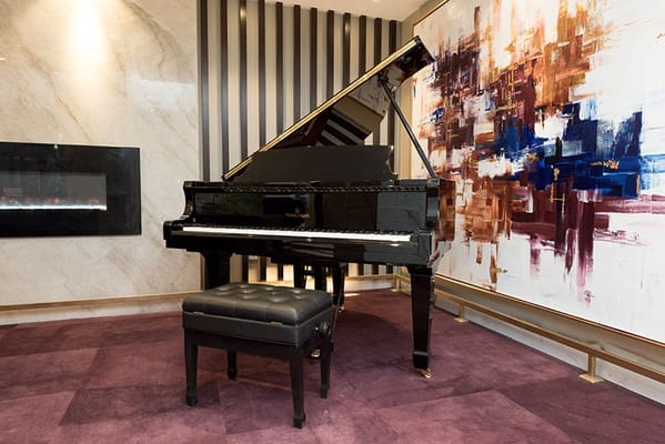 A grand piano in a stylish lounge area