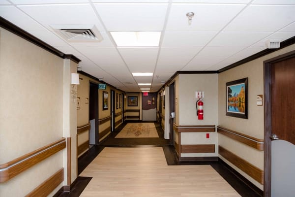 Interior hallway with artwork and emergency equipment