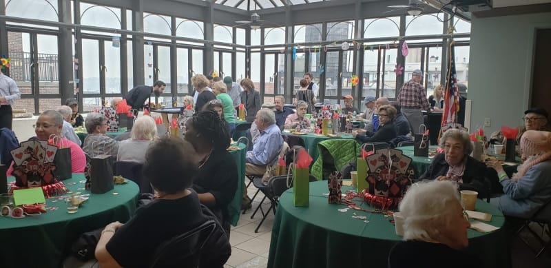 Residents enjoying a festive event in a common area