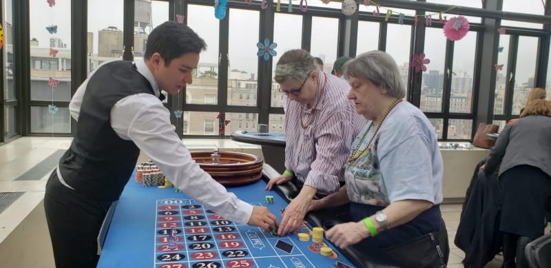Residents playing roulette in an activity room