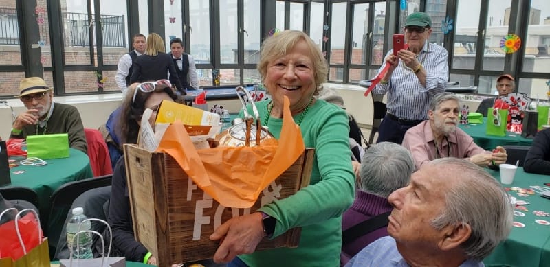 Residents enjoying an activity in a bright common area
