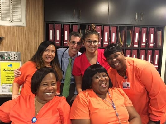 Staff members posing together in the facility