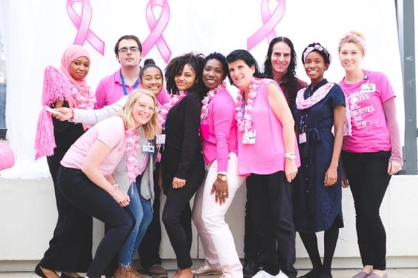 Staff and residents participating in a pink-themed event