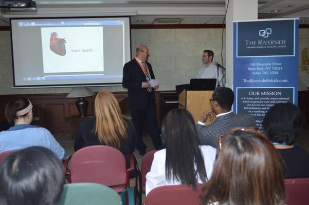 Staff presenting at a wellness event in the center's common area