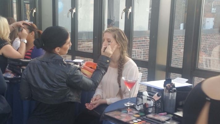 Residents enjoying a makeup session in a bright room