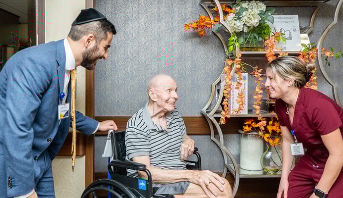 Staff and resident interacting in a common area