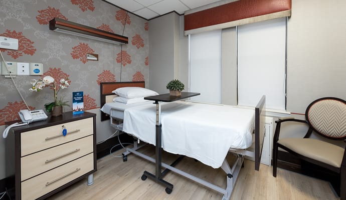 A well-furnished resident room with modern decor