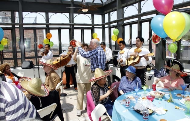 Residents enjoying a festive celebration with music and food