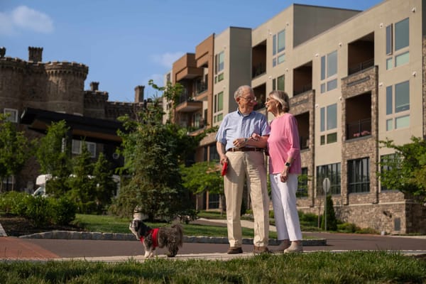 Couple enjoying a stroll outside the building